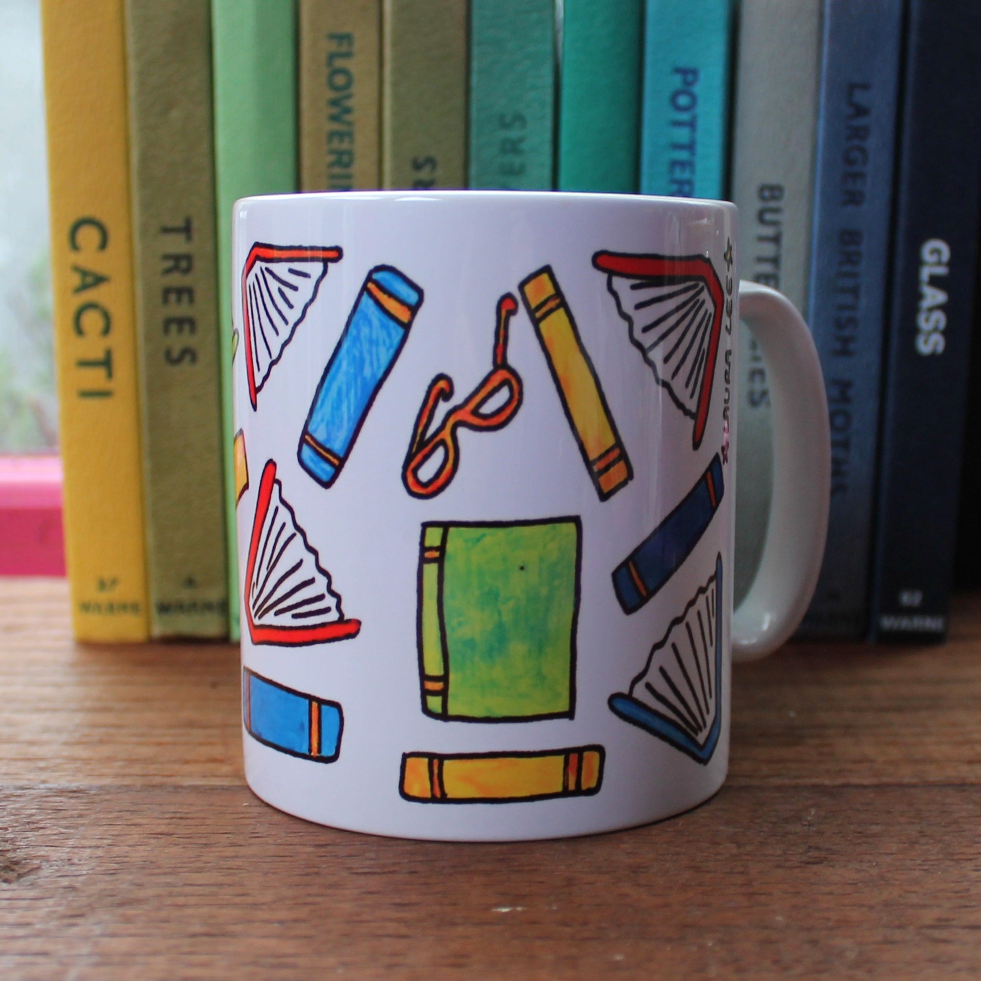 Colourful books readers fuel mug by Laura Lee Designs in Cornwall printed stoneware mug